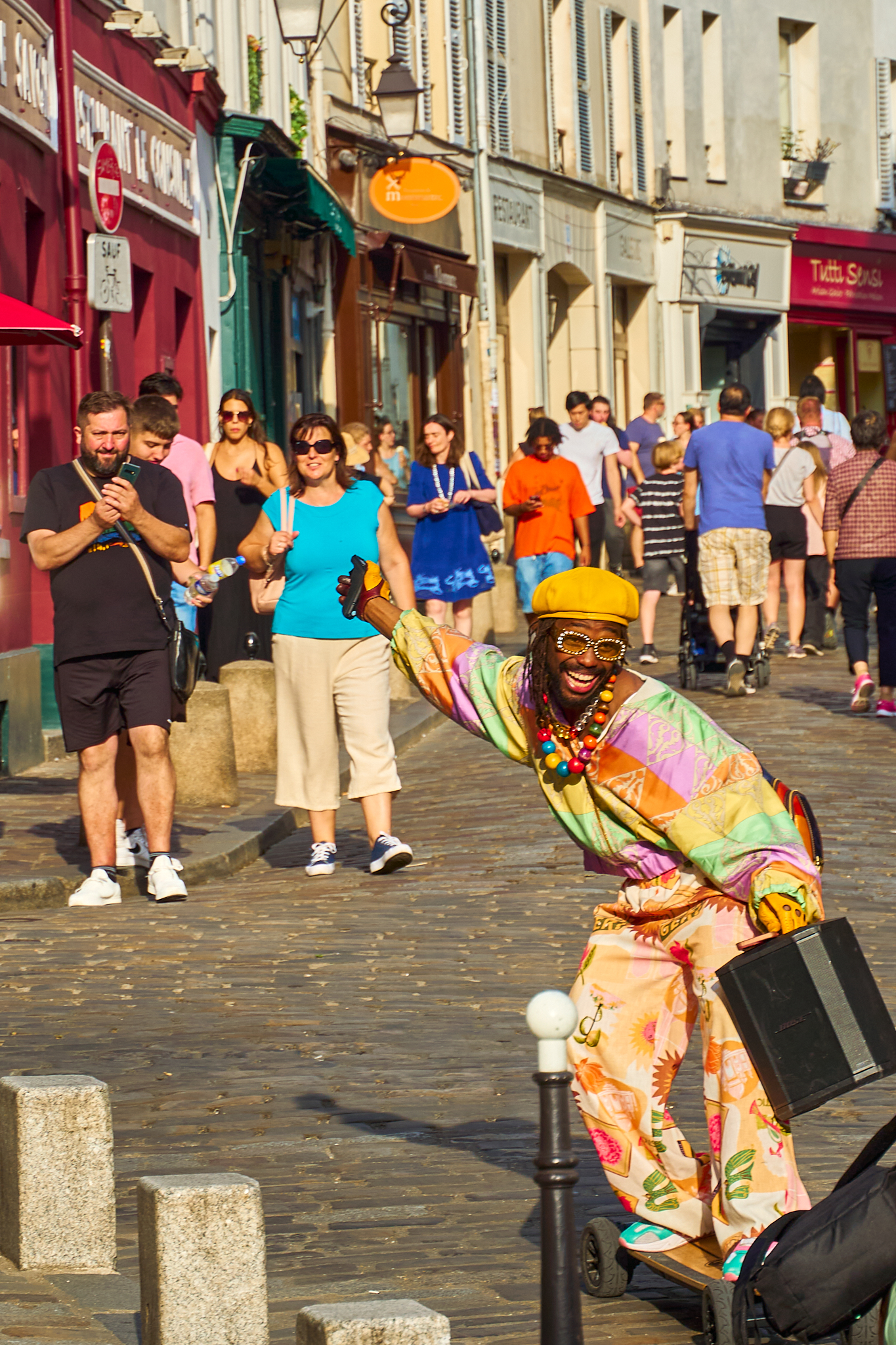 Colorful street performer greeting passersby